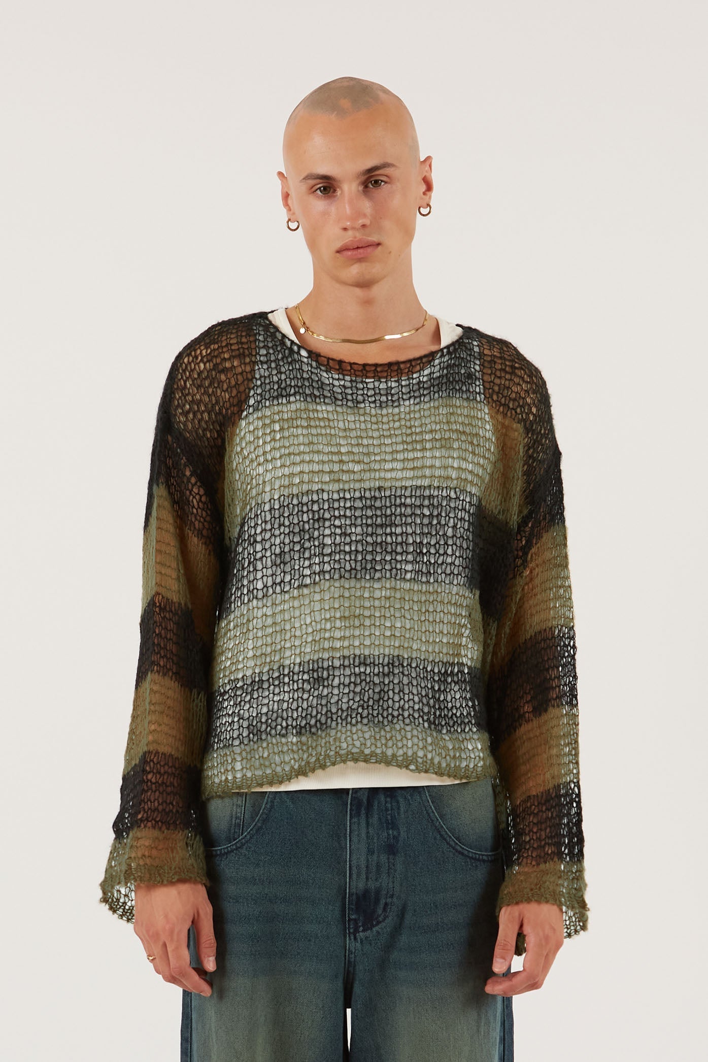 Male wearing Green & Black Stripe Knit Jumper. 