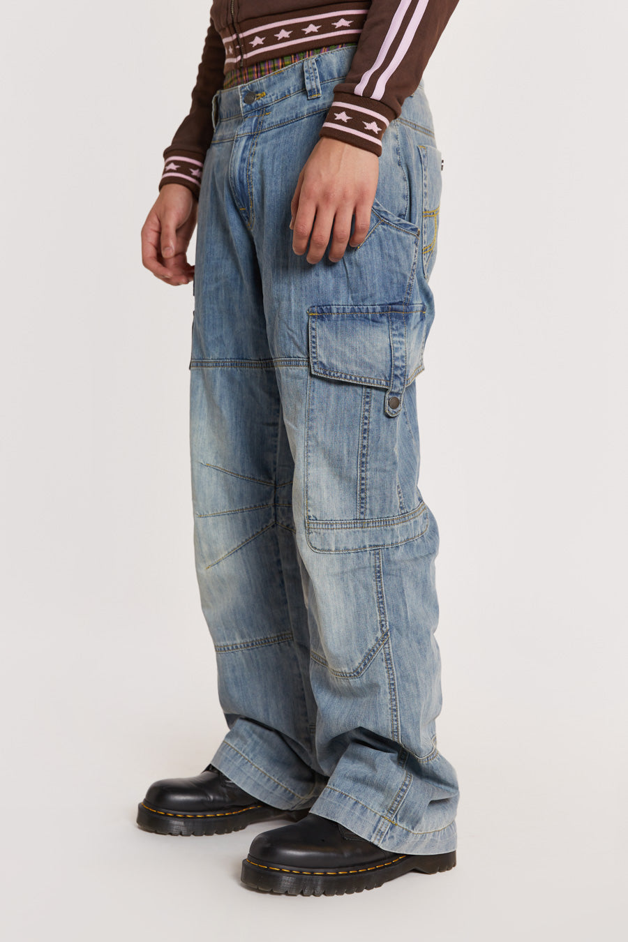 Male model wearing Light Wash Millennium Cargo Jeans. 