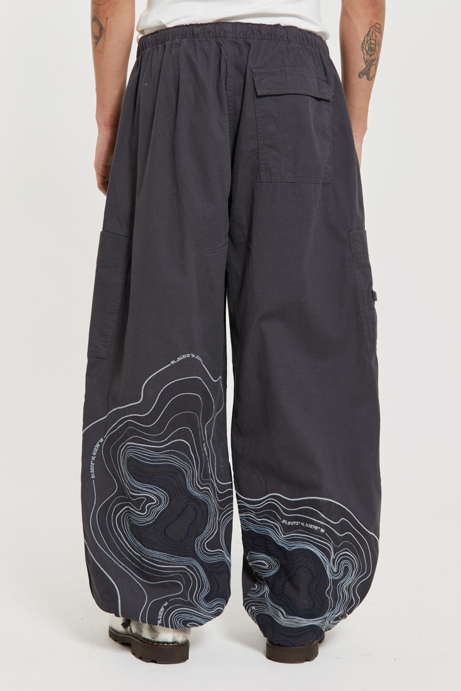 Men's charcoal grey cargo parachute pants featuring 'Scene' embroidery