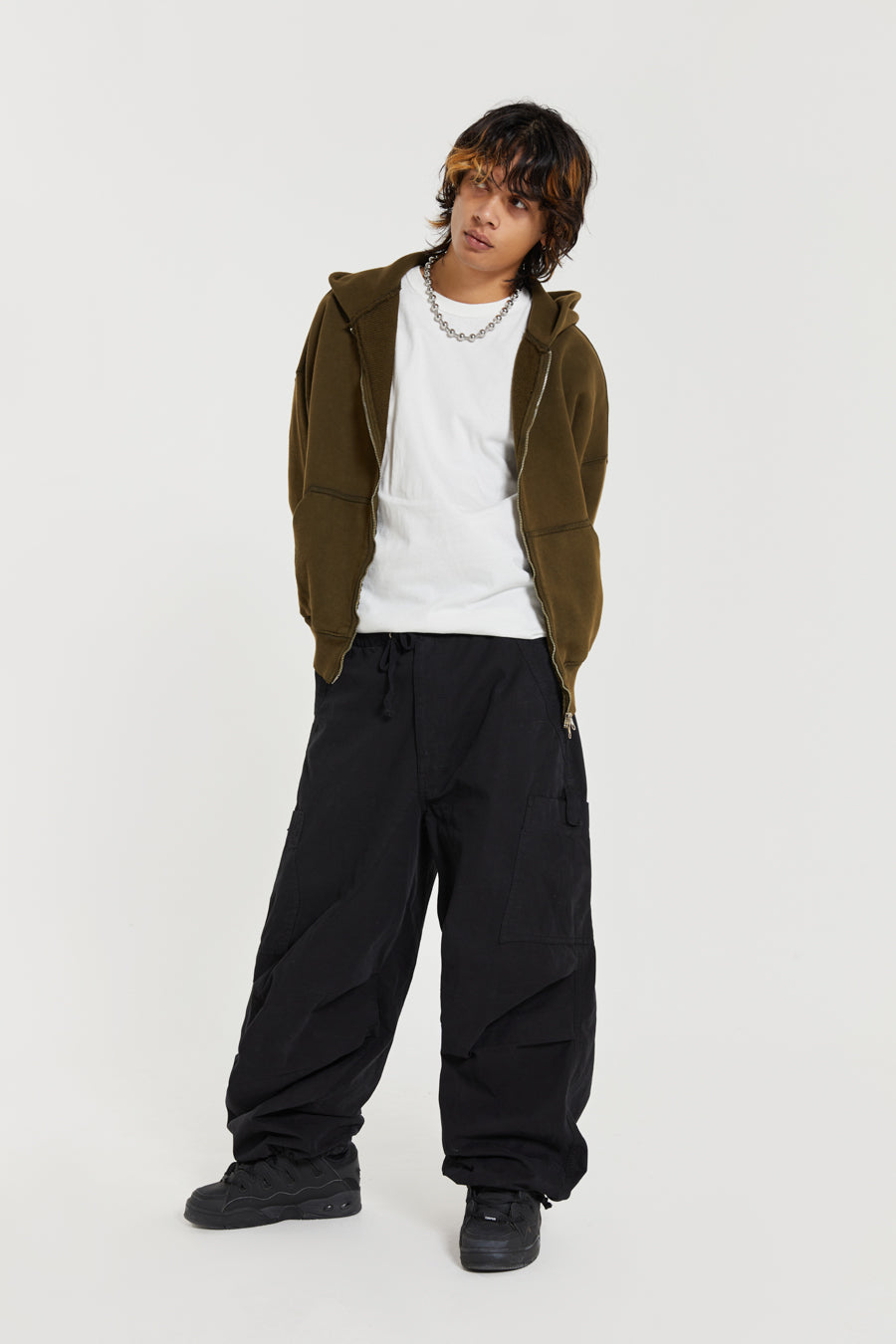 Unisex black oversized fitted parachute style cargo trousers with six pocket styling. 