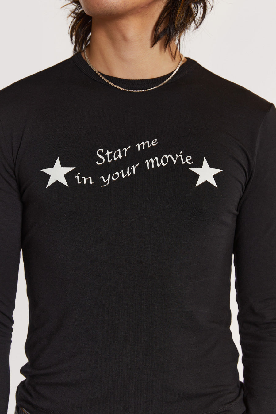 Male model wearing Black Long Sleeve Top With Movie Star Graphic. 