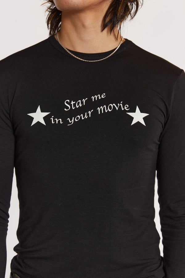 Male model wearing Black Long Sleeve Top With Movie Star Graphic. 