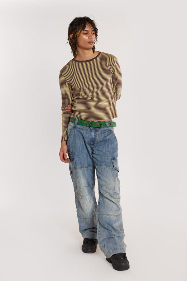 Male model wearing Micro Ribbed Jersey Long Sleeve Tee styled with blue denim jeans.