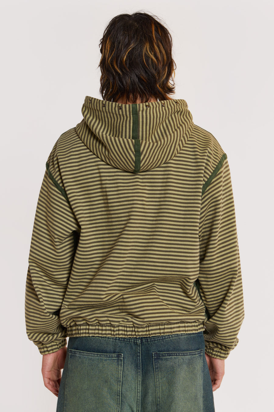 Male model wearing Green Micro Stripe Zip Hoodie . 