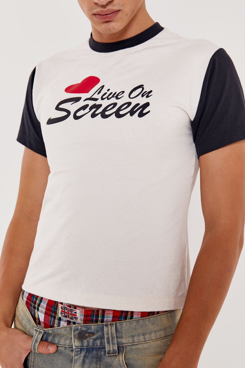 Male wearing white short sleeve crew neck t-shirt with Live On Screen print on front.