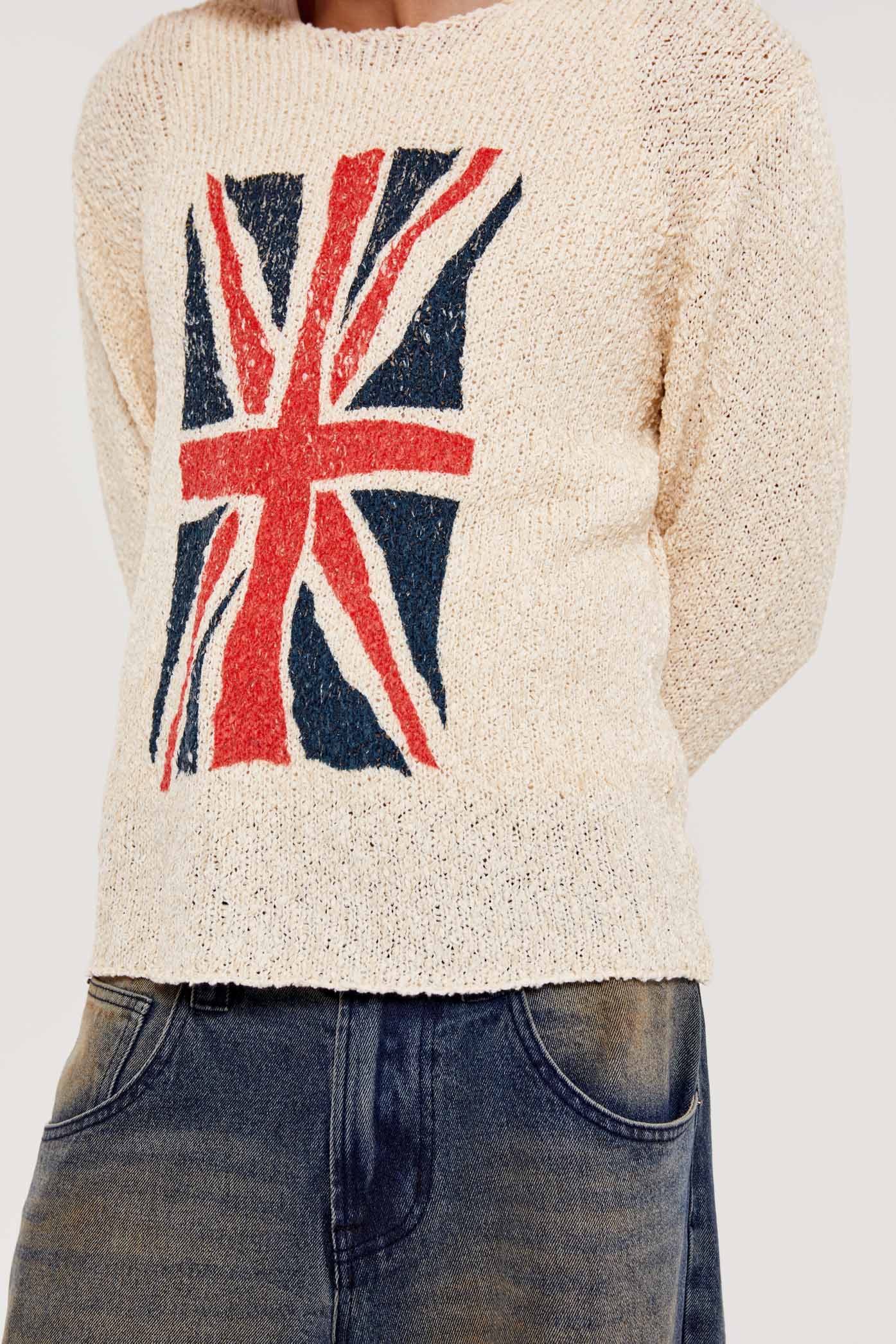 Male wearing white Union Jack printed long sleeve loose knitted crew neck jumper. 