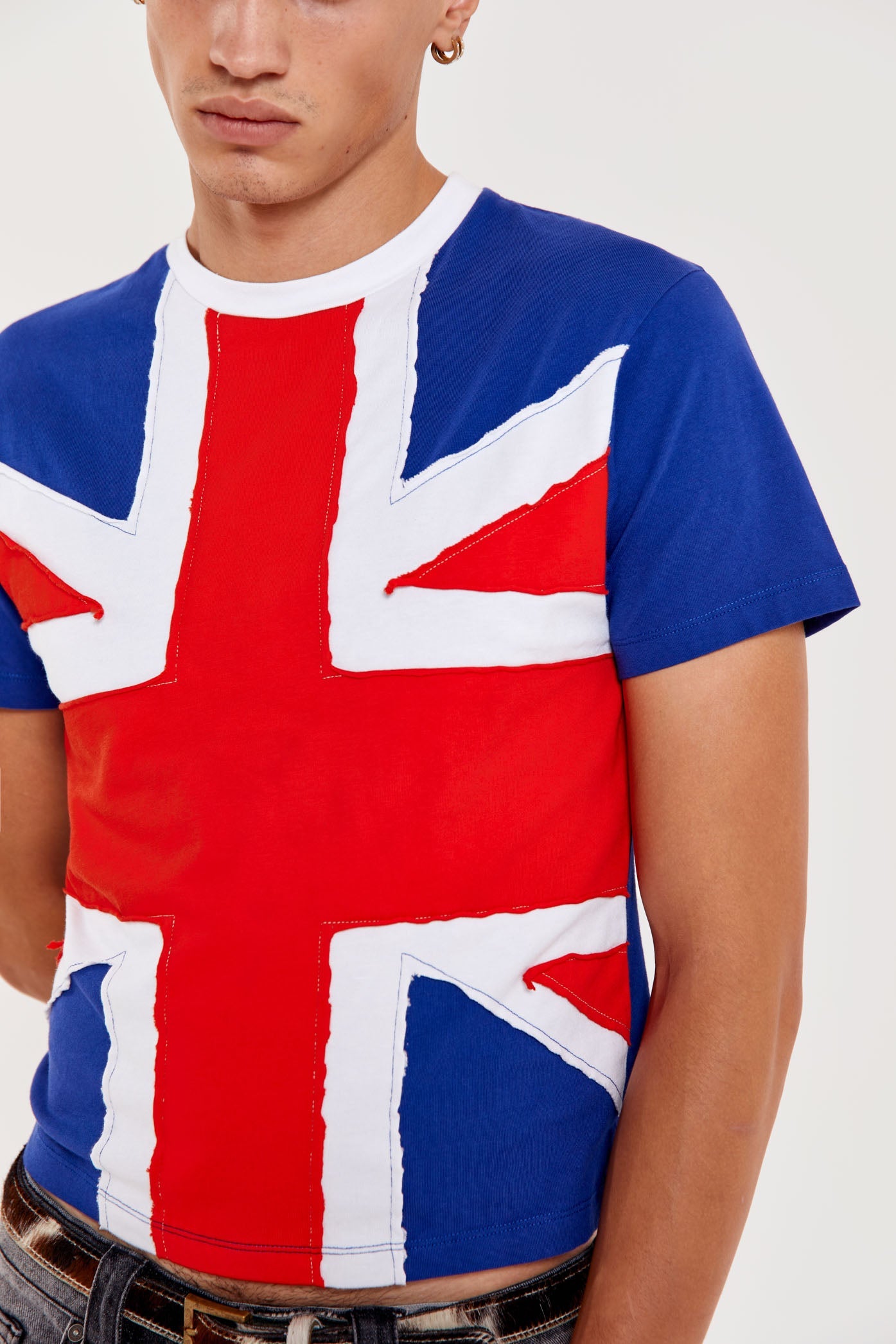 Male wearing shrunken Union Jack printed crew neck short sleeve t-shirt.