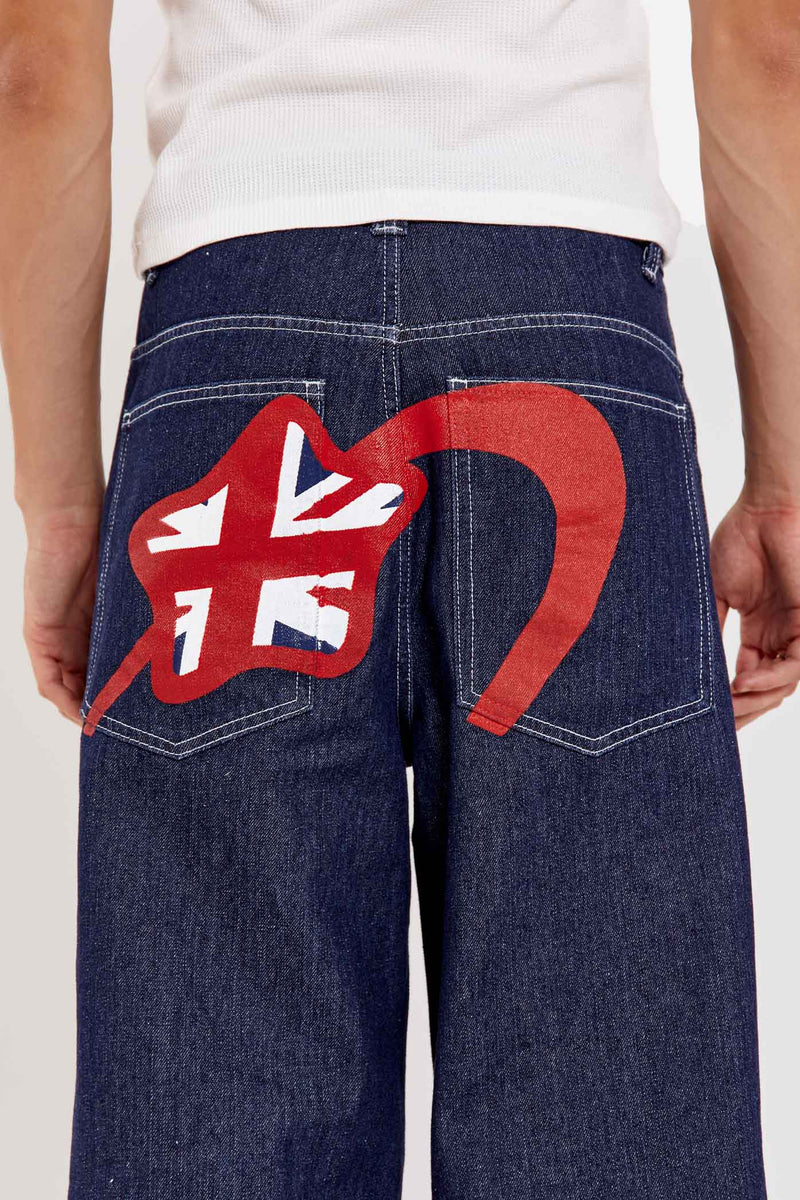 Male wearing indigo blue denim jeans in a jumbo fit with Union Jack star branding on back pocket. 