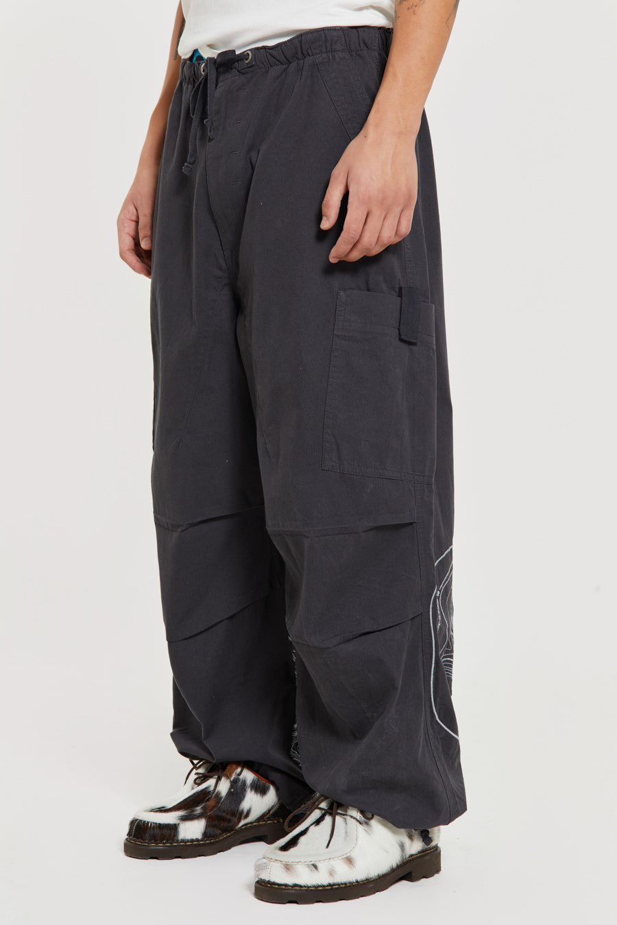 Men's charcoal grey cargo parachute pants featuring 'Scene' embroidery