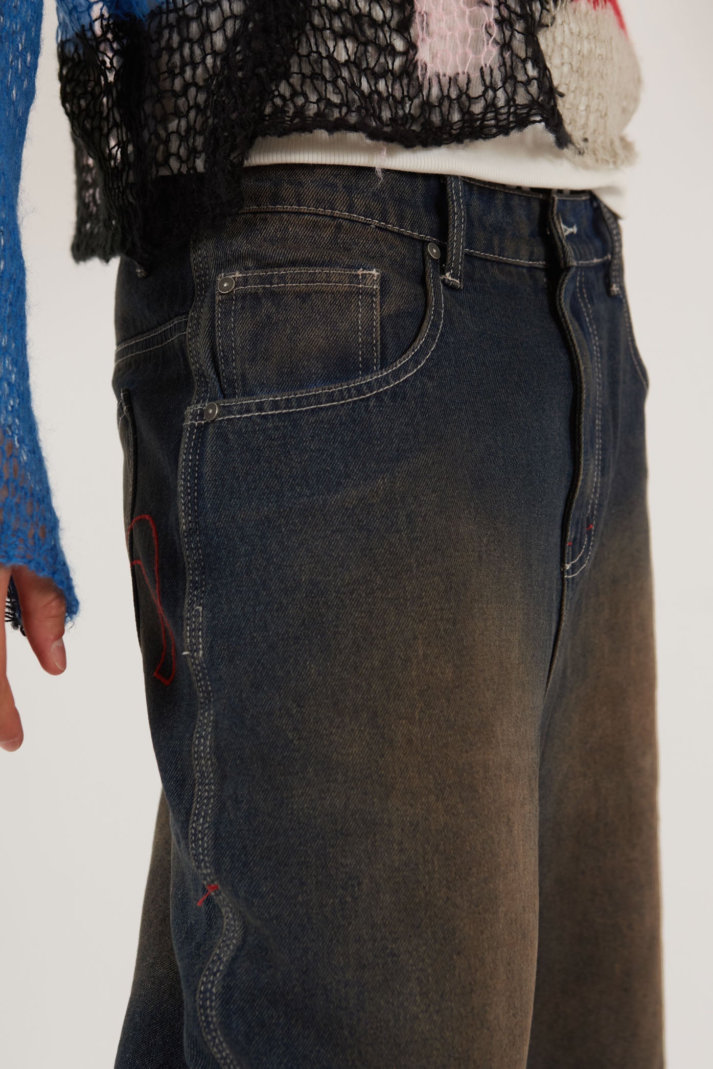 Male wearing Dark Rinse Denim Shorts Jumbo Fit. Styled with knitted jumper.