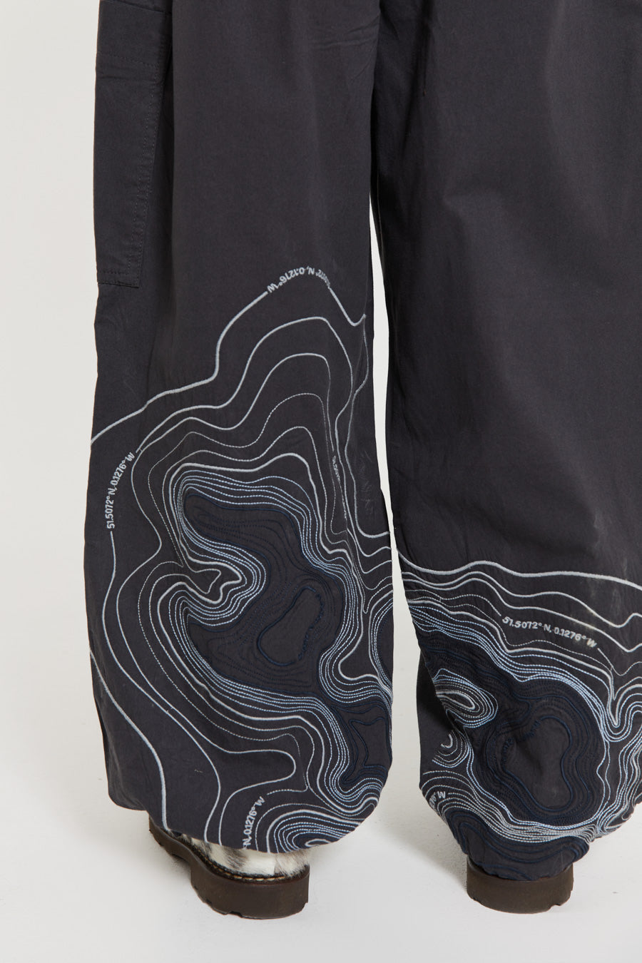 Men's charcoal grey cargo parachute pants featuring 'Scene' embroidery