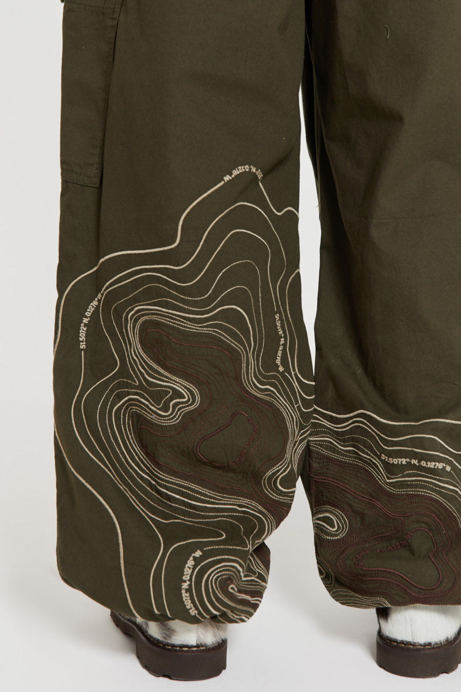 Men's khaki green cargo parachute pants featuring 'Scene' embroidery