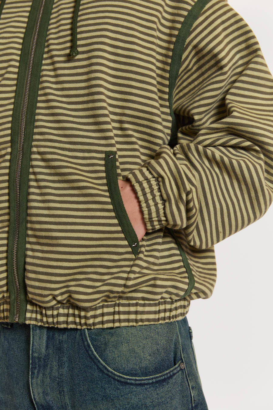 Male model wearing Green Micro Stripe Zip Hoodie . 