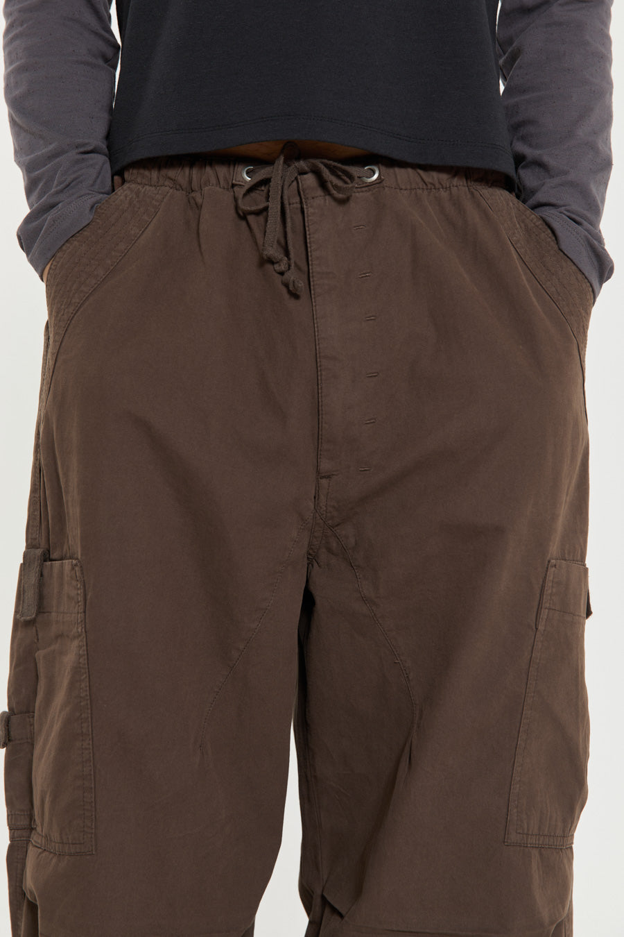 Unisex brown oversized fitted parachute style cargo trousers with six pocket styling. 