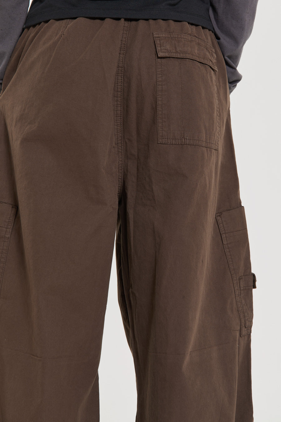 Unisex brown oversized fitted parachute style cargo trousers with six pocket styling. 