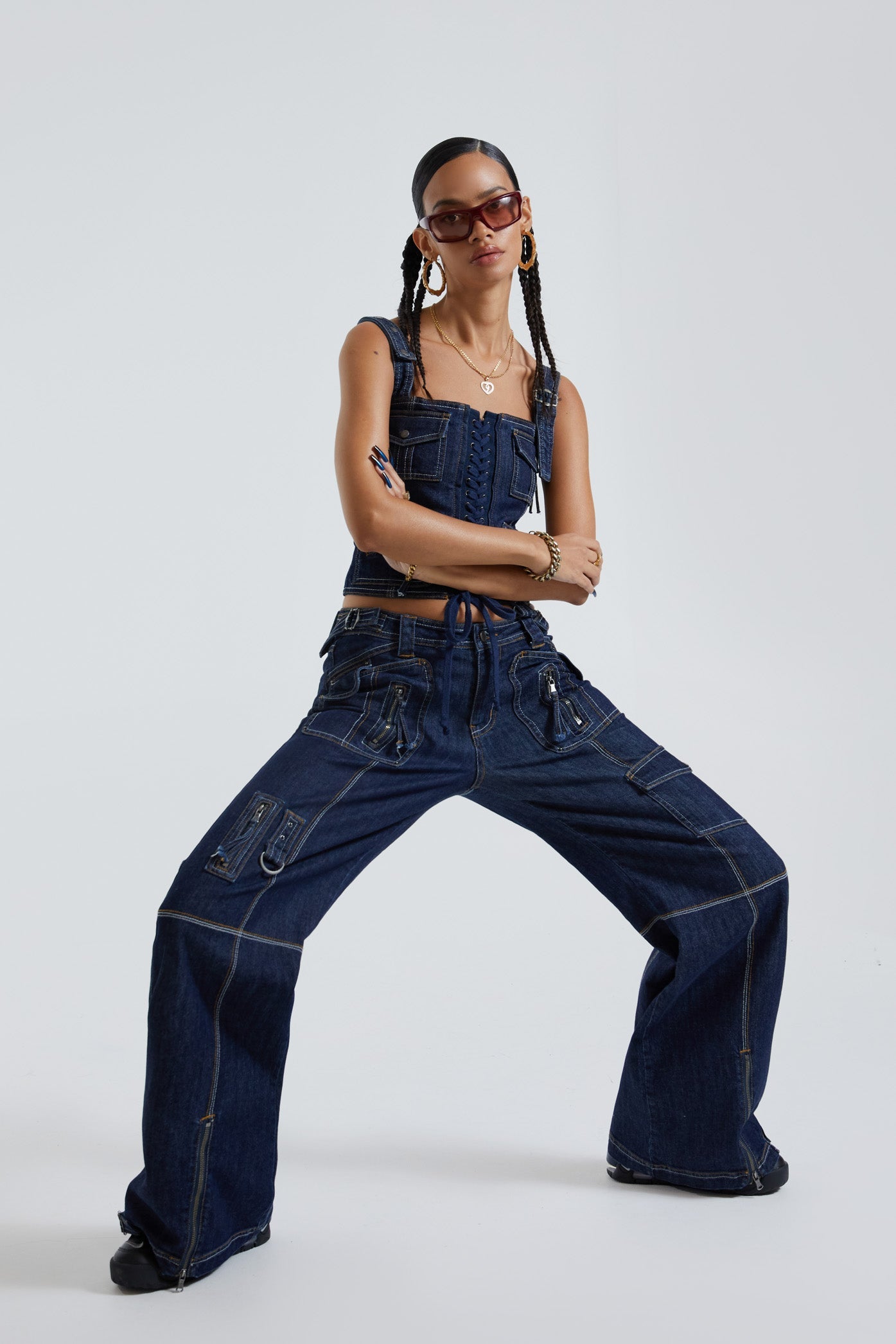 Female wearing blue denim cargo trousers with pocket detail. Styled with the matching denim cargo corset top. 