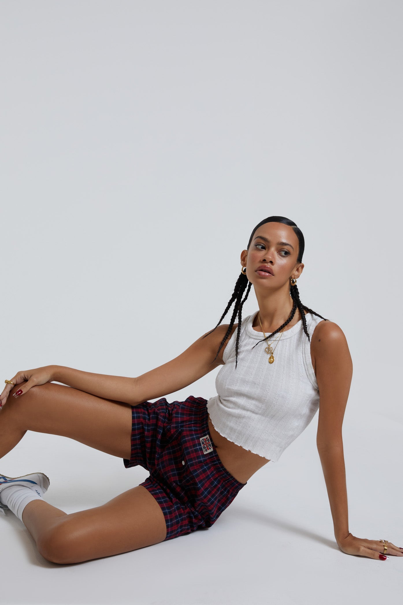 Female wearing blue and green tartan boxer shorts with Union Jack woven label detail.  