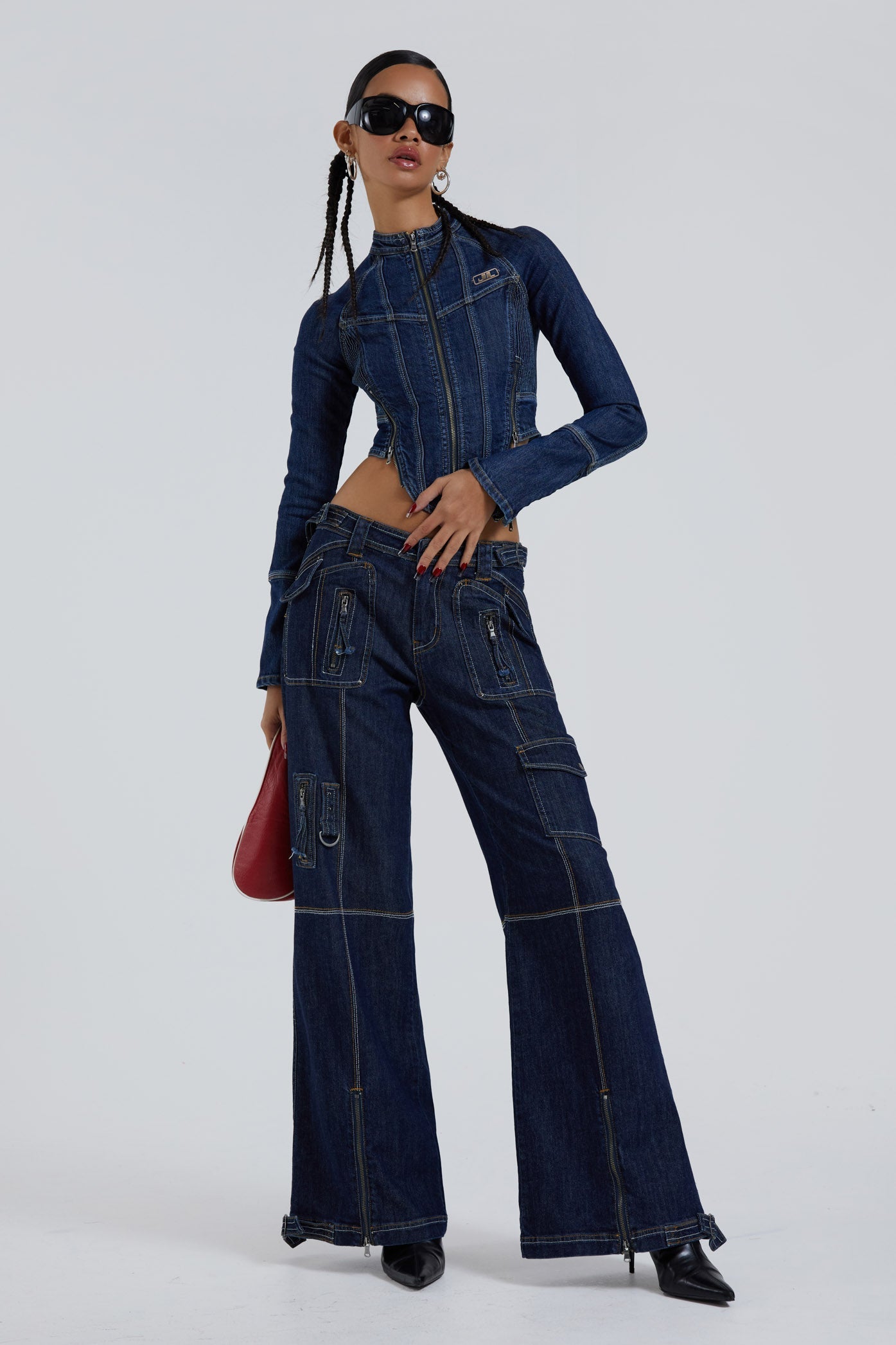 Female wearing blue denim corset motorcycle long sleeve jacket. Styled with the matching denim cargo trousers. 