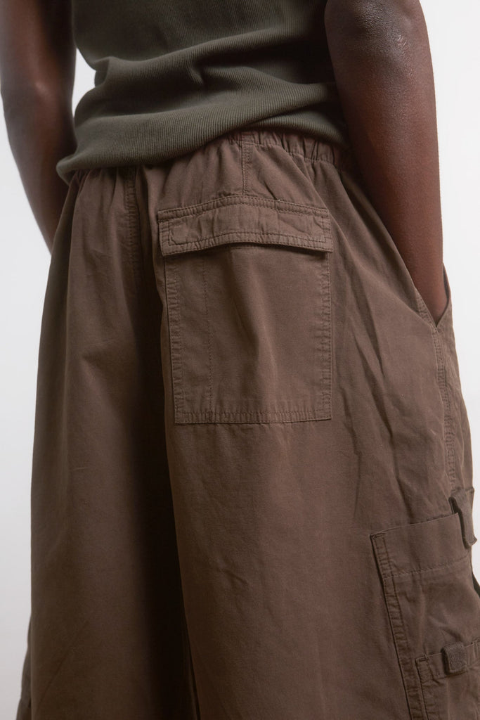Male wearing Brown Oversized Cargo Shorts.