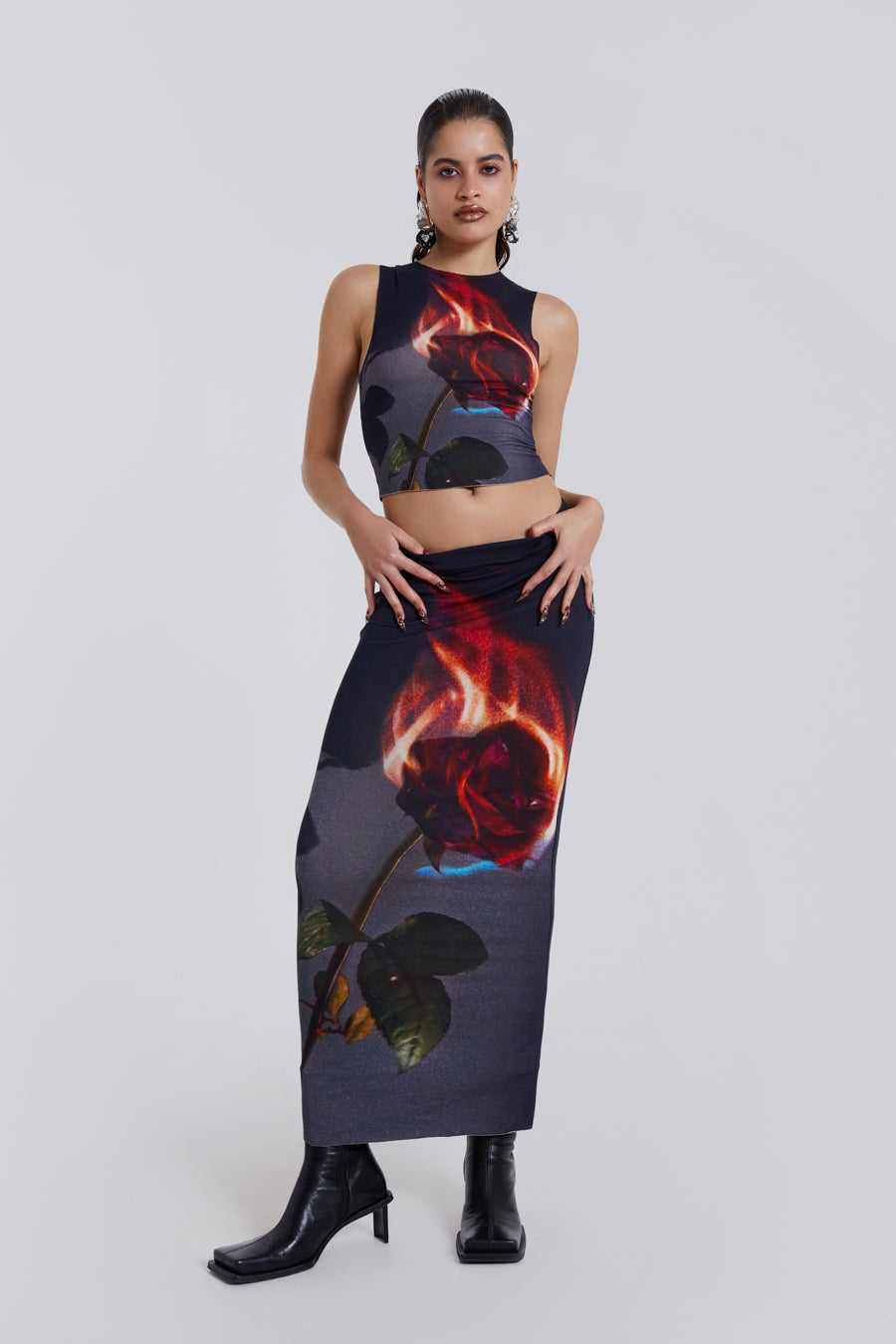 Female model wearing Flaming Rose Raw Edge Tank Top. Styled with the matching maxi length skirt. 