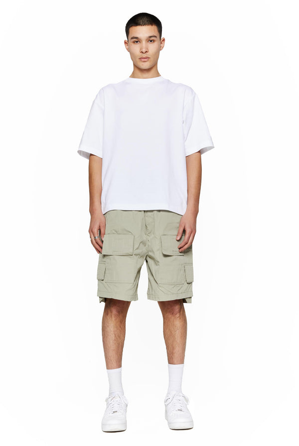 Green oversized cargo shorts in relaxed fit with ten pocket styling detail. 