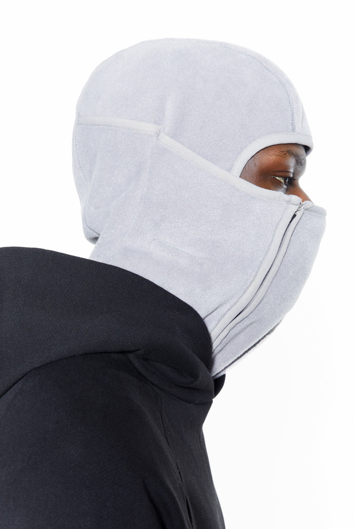 Grey polar fleece double zip balaclava. Styled with a black hoodie. 