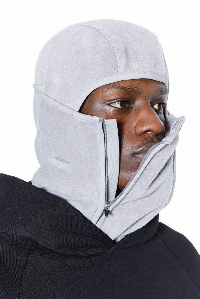 Grey polar fleece double zip balaclava. Styled with a black hoodie. 