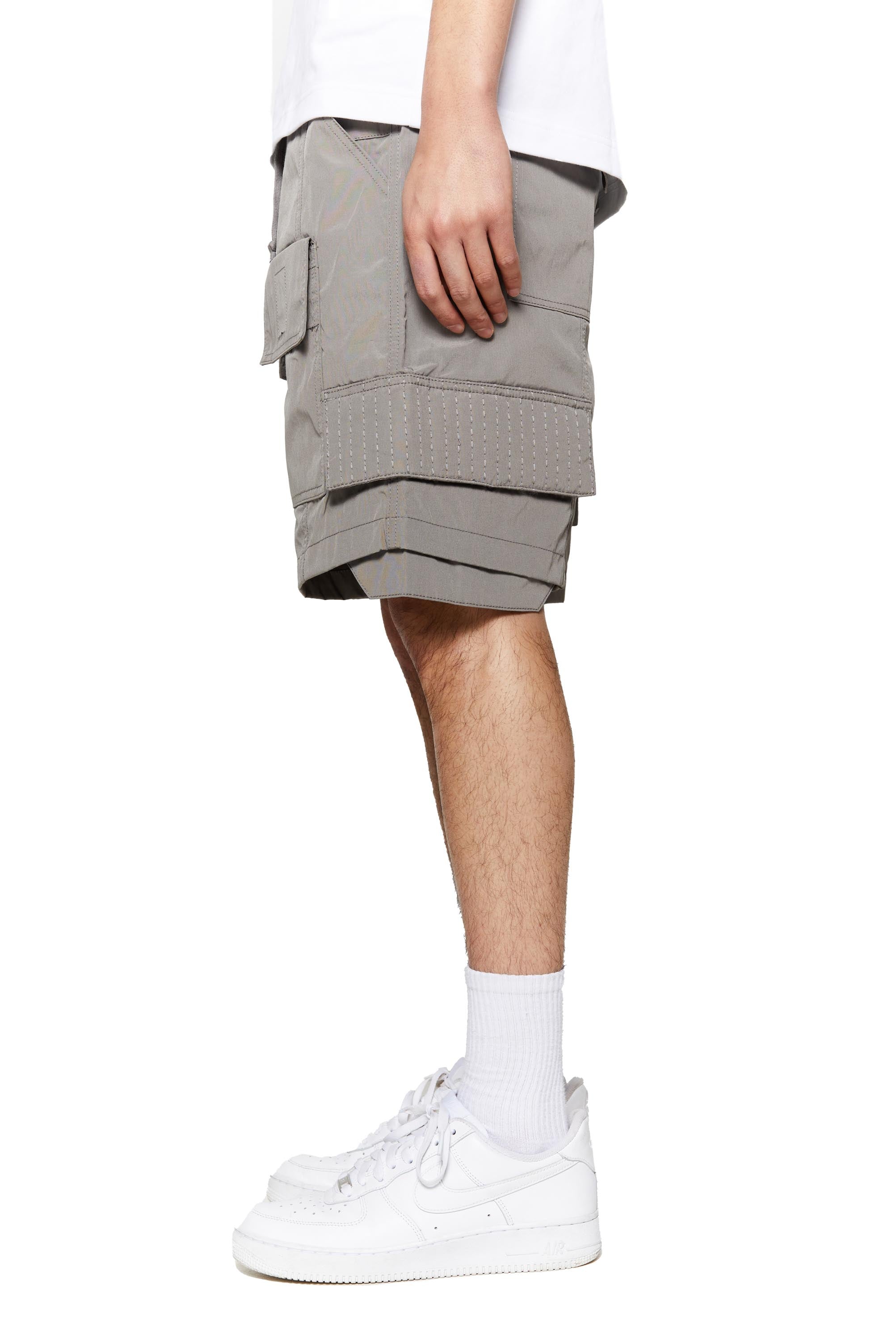 Grey oversized cargo shorts in relaxed fit with ten pocket styling detail. 