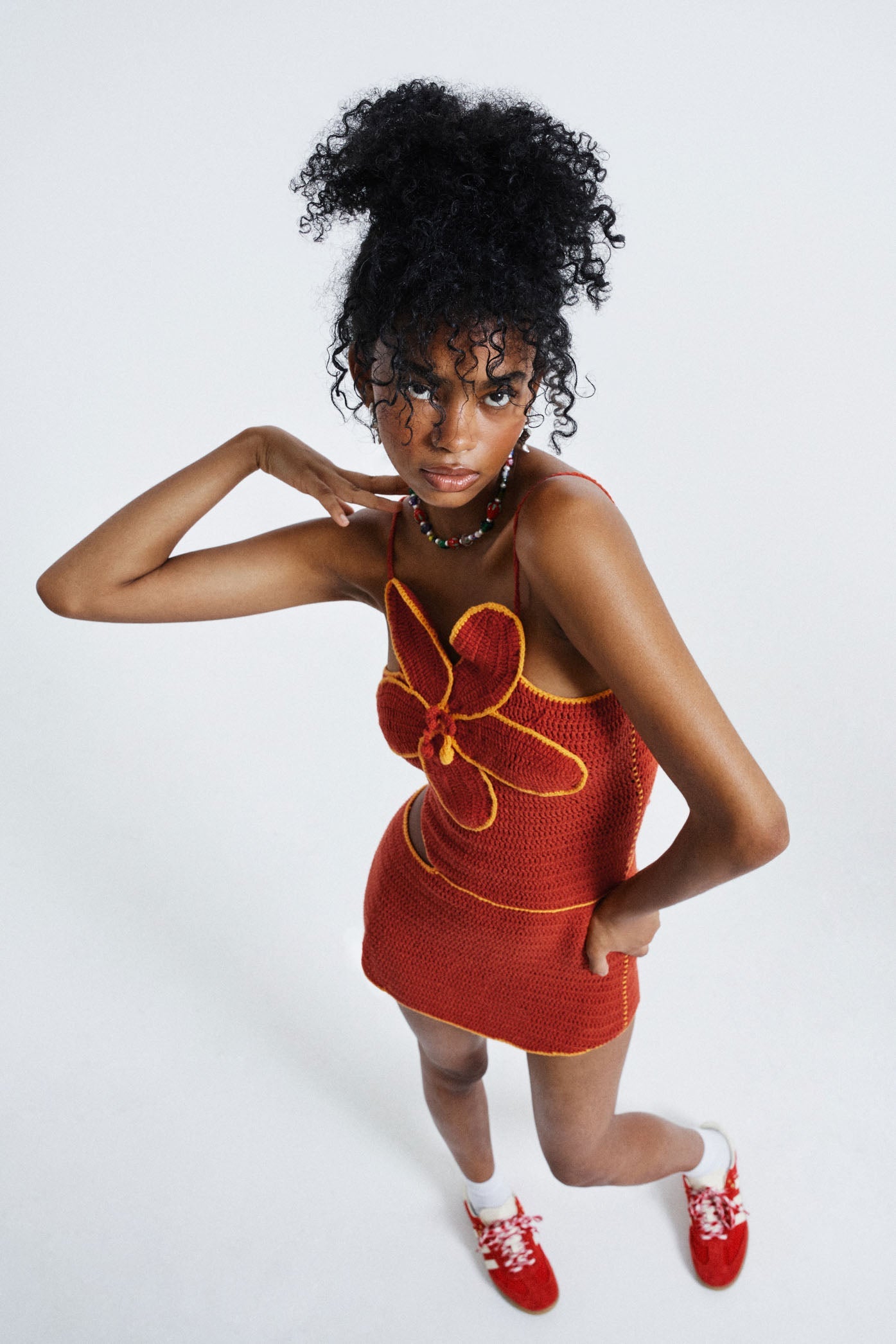 Female wearing Red Hibiscus Floral Crochet Dress. 