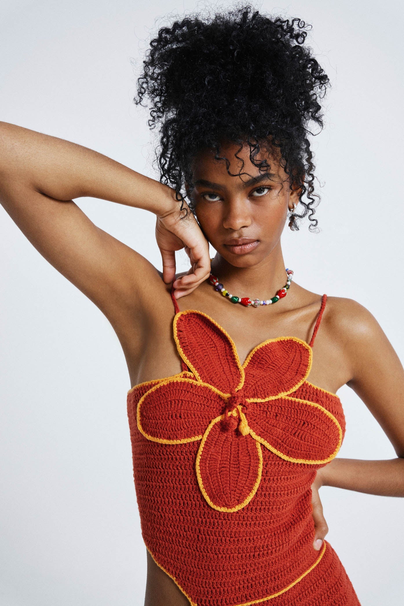 Female wearing Red Hibiscus Floral Crochet Dress. 