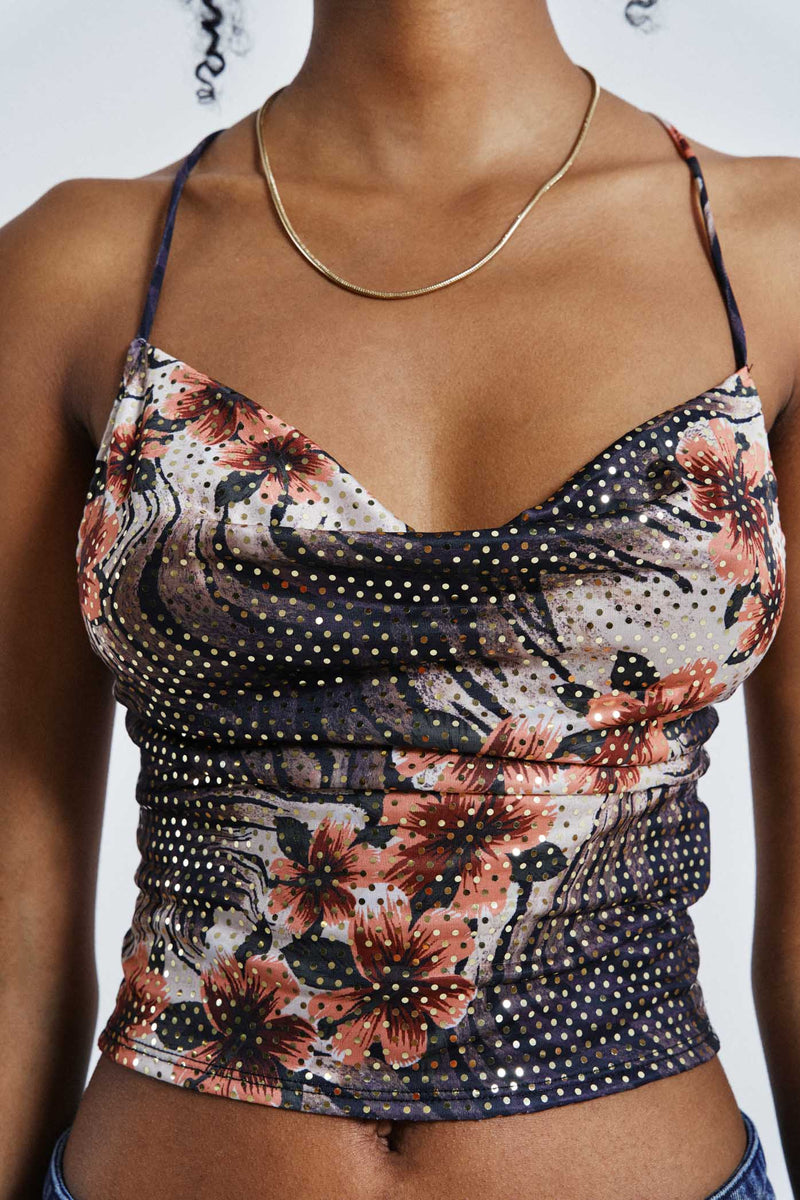 Female wearing Floral Print Cowl Neck Cami Top. Styled with washed blue lace up jeans.