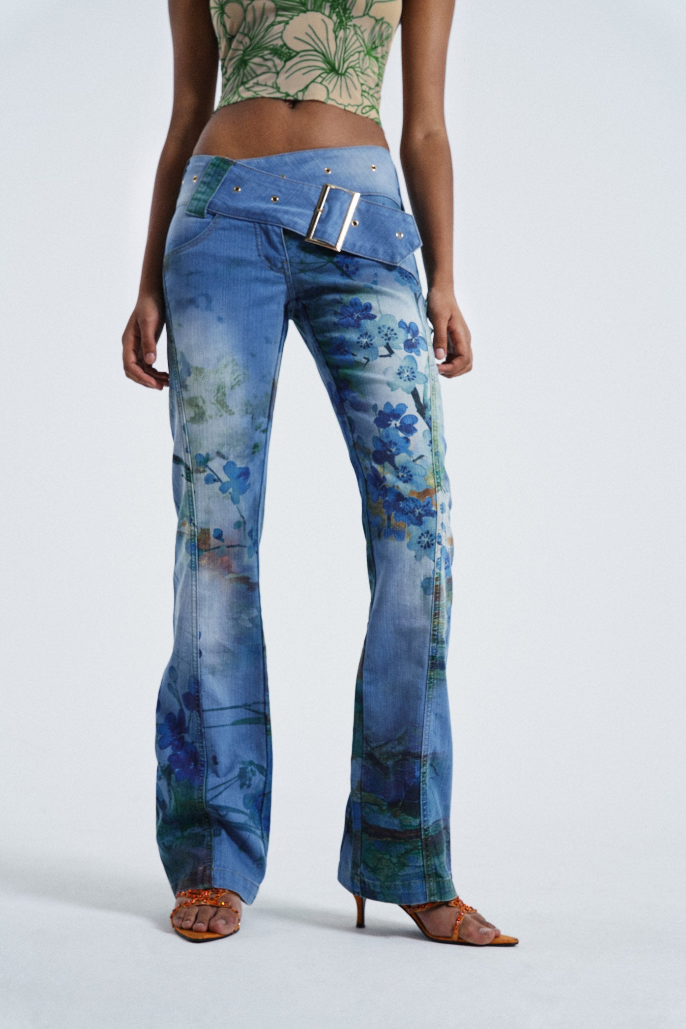 Female wearing Blossom Peel Print 00's Contrast Belt Detail Low Rise Slim Fit Bootcut Jeans 