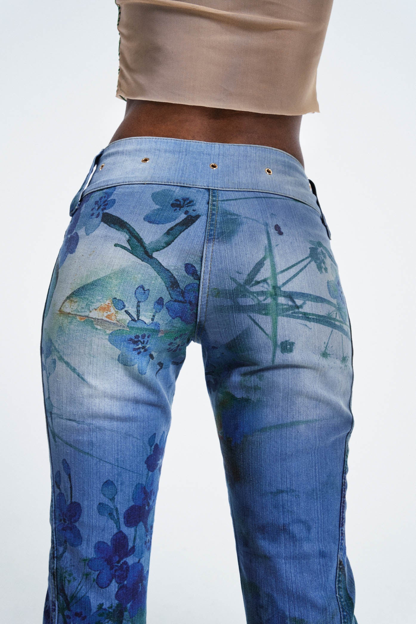 Female wearing Blossom Peel Print 00's Contrast Belt Detail Low Rise Slim Fit Bootcut Jeans 