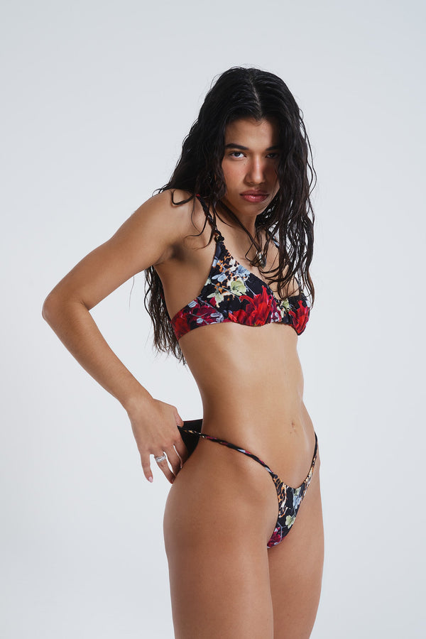 Female model wearing Dark Romantic Leopard Print Crop Ruched Cup Bikini Top. Styled with the matching micro bikini bottoms. 