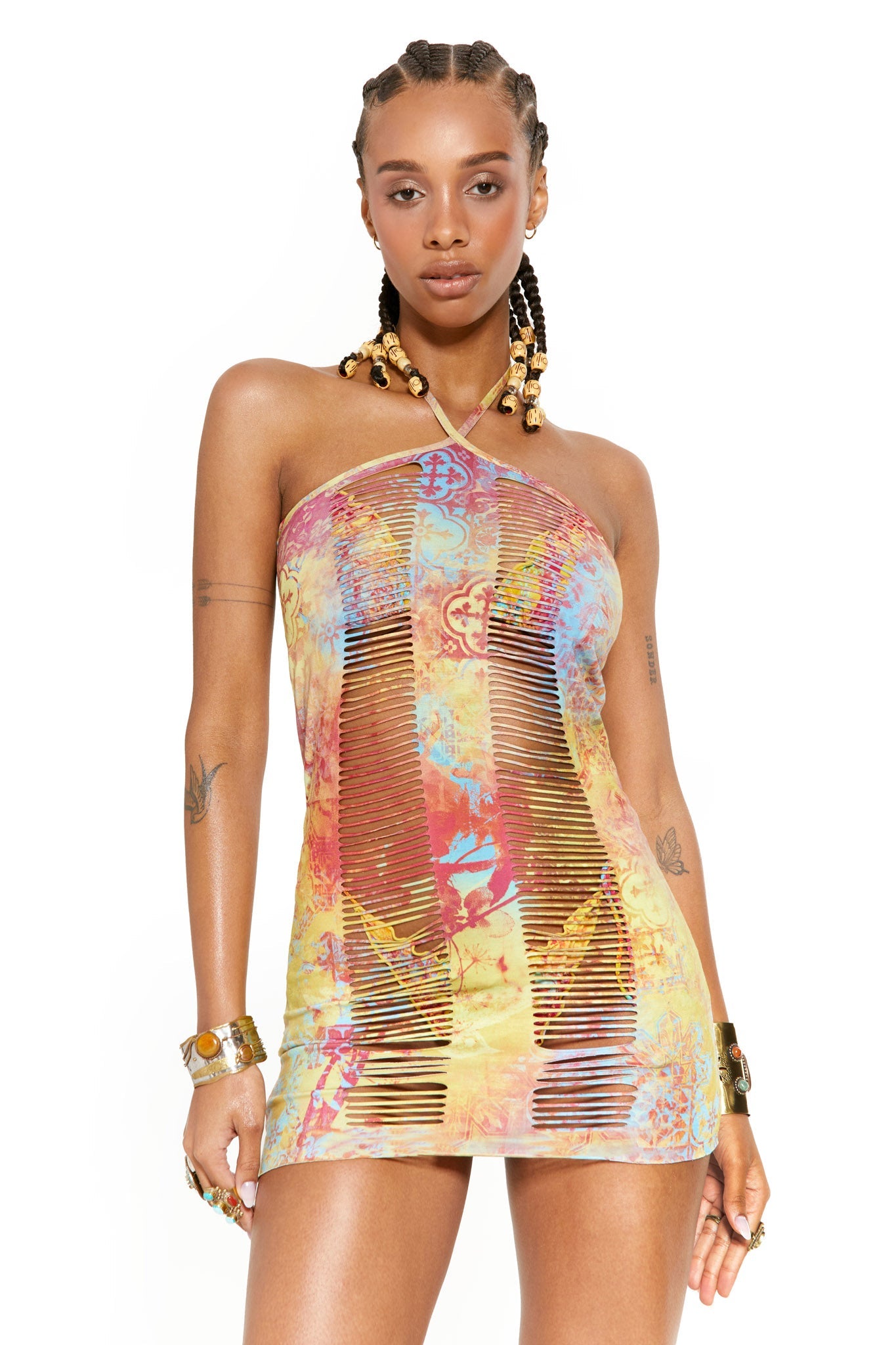 Female model wearing Mosaic Baroque Print Slashed Halter Mini Dress with halterneck detail.  