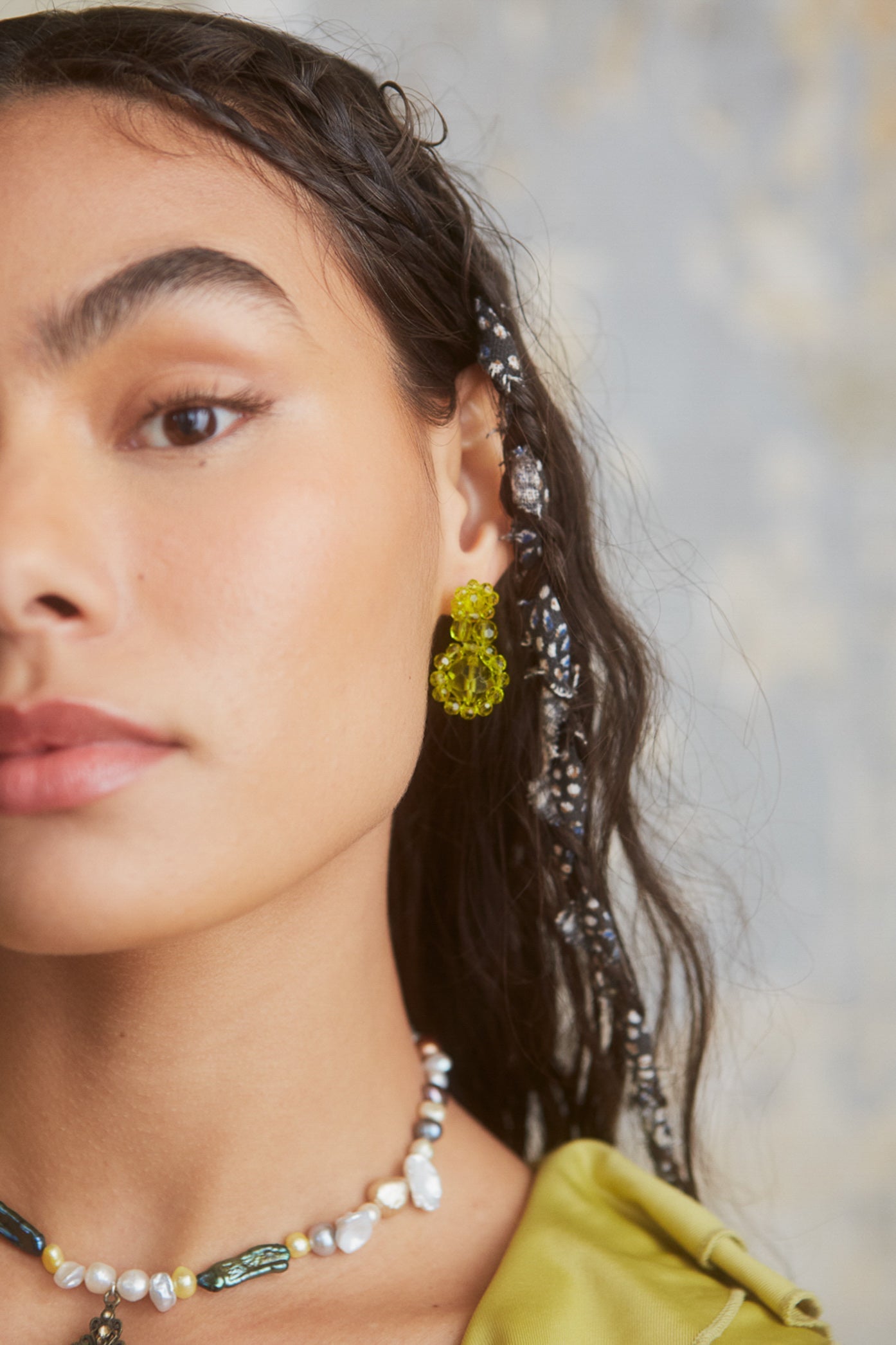 Female wearing Green Resin Flower Beaded Earrings. 