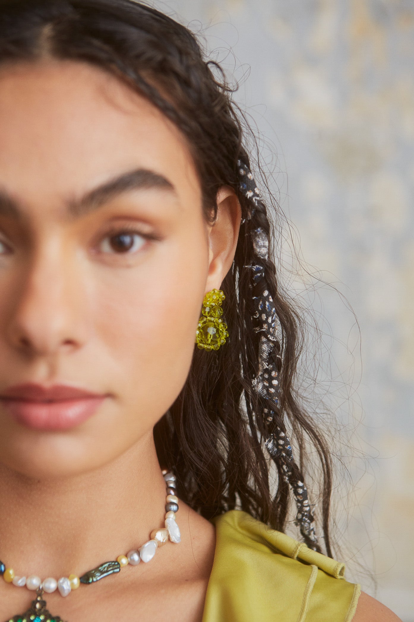 Female wearing Green Resin Flower Beaded Earrings. 