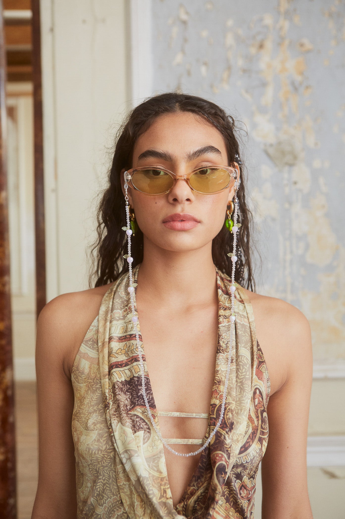 Female wearing Champagne Oval Sunglasses. 