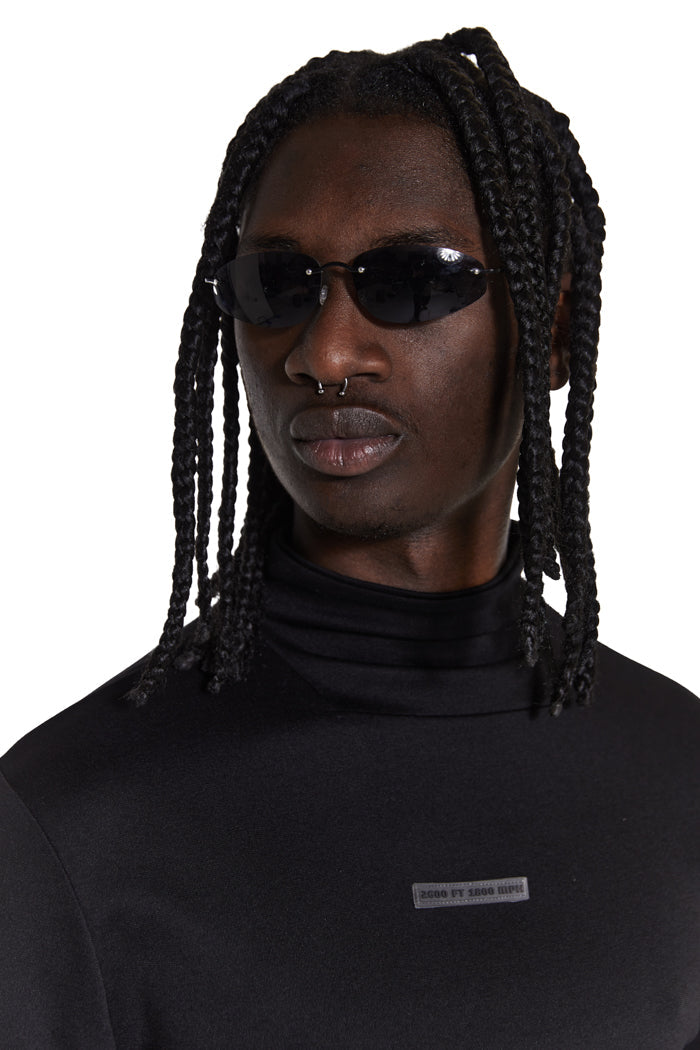 Model wearing unisex black lense slim line sunglasses
