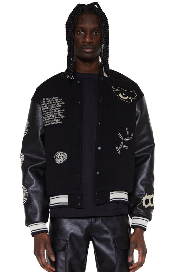 Black oversized varsity jacket with vegan leather sleeves and embroidered & applique leather back panel.