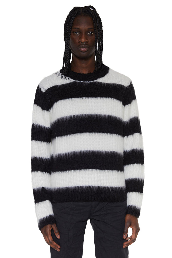 Black and white striped hairy knit oversized jumper. Styled with black jeans. 