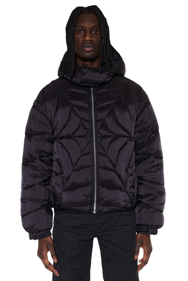 Black zip up front oversized spider puffer jacket with detachable hood and sleeve detail. 