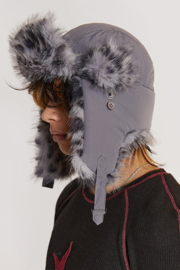 Grey leopard print faux fur trapper style hat. 