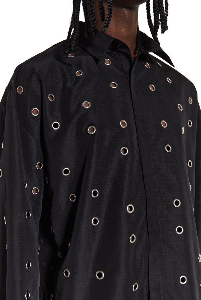 up close detail of oversized button up black shirt