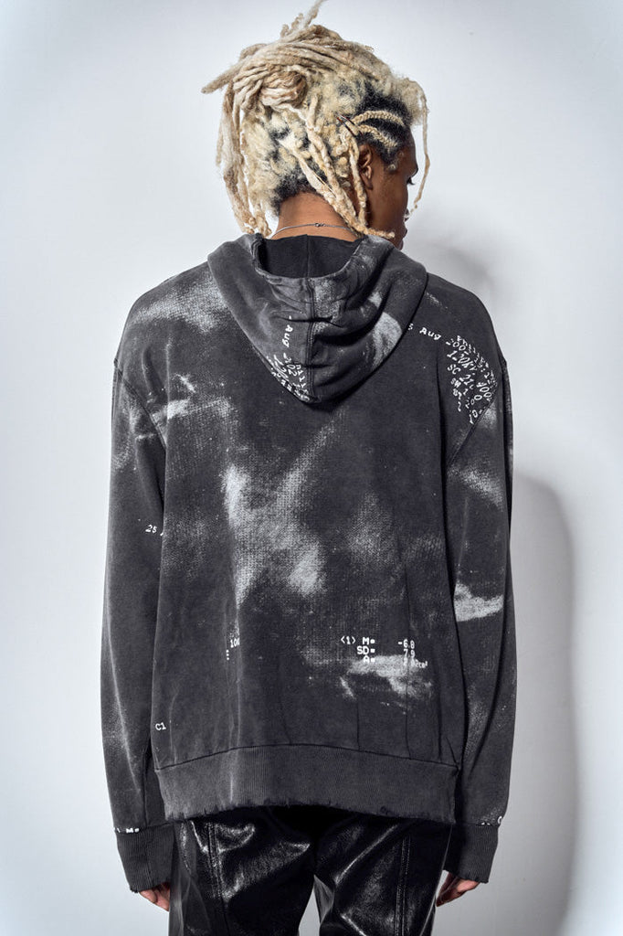 Back view of acid wash black zip up hoodie with ribcage print