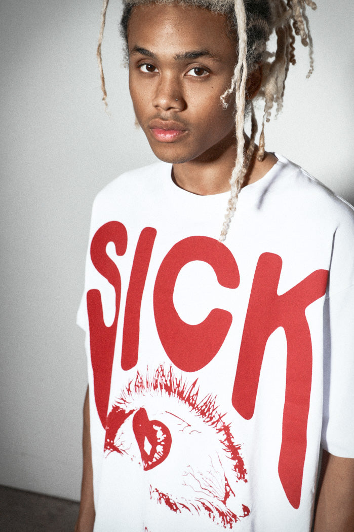 Close up of white oversized t-shirt with red graphic print
