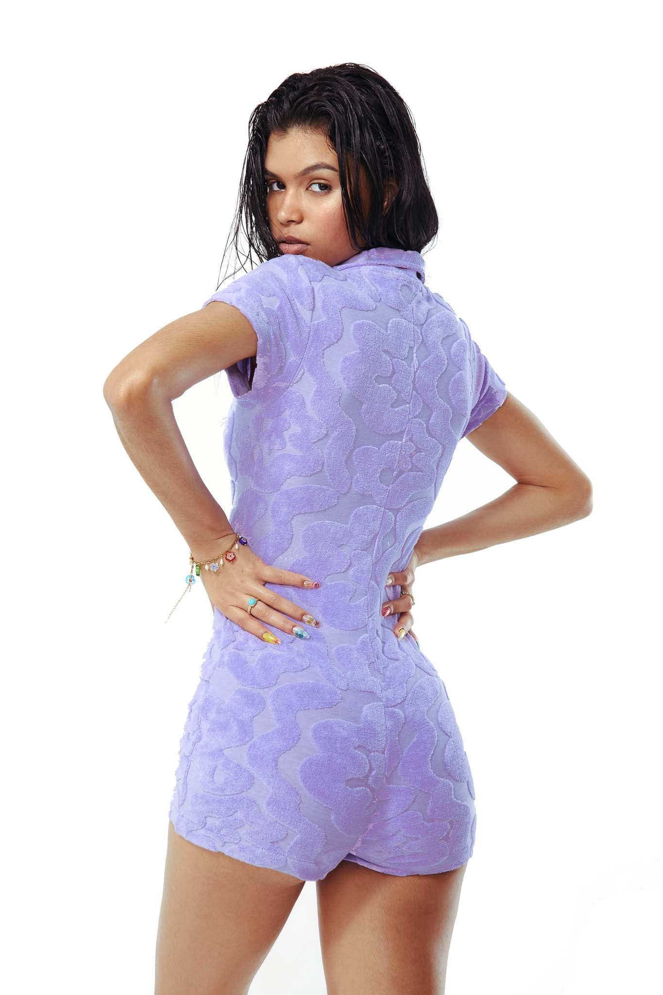 Lilac squiggle embossed towel button up front playsuit. 