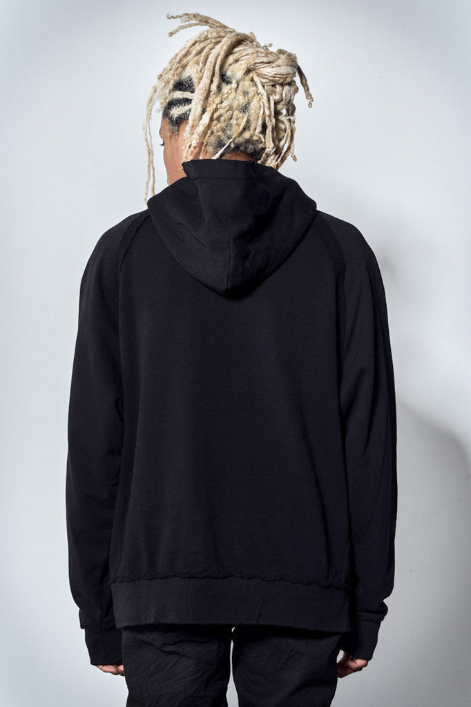 Back view of oversized black hoodie with white graphic print