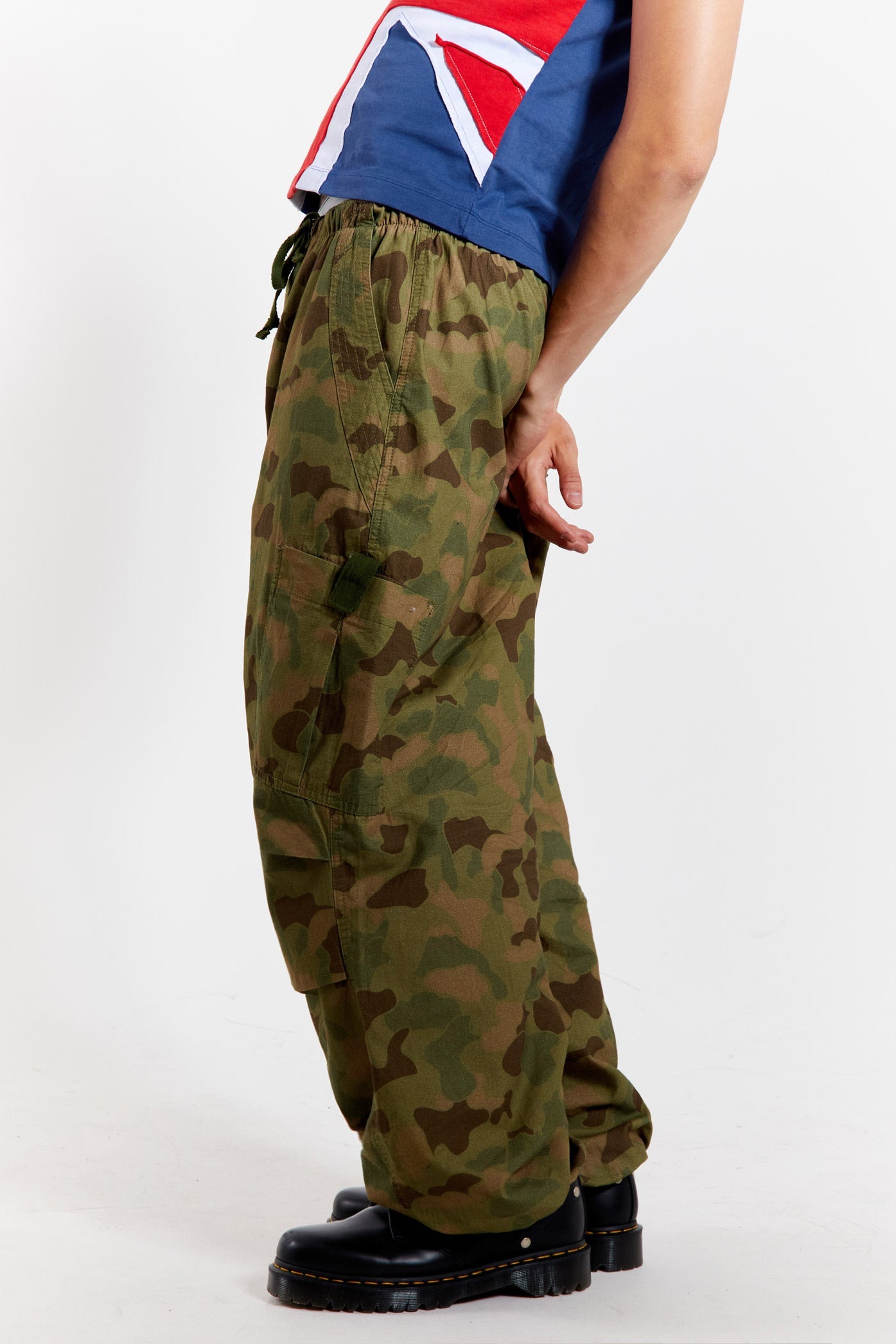 Men's camo printed military inspired parachute cargo pants.