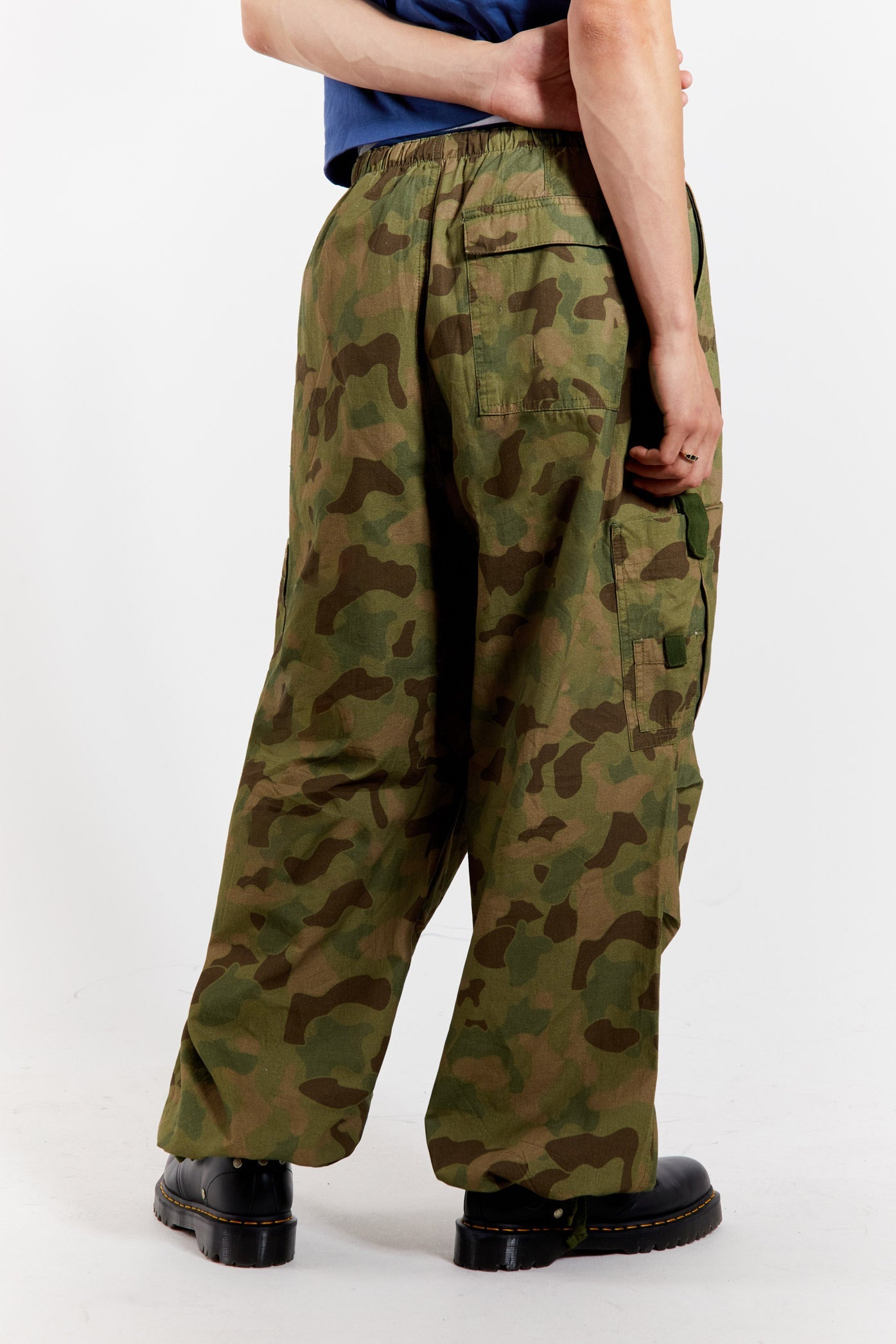 Men's camo printed military inspired parachute cargo pants.